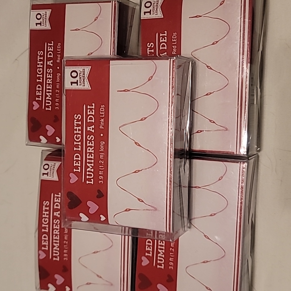 Lot of 7 pink and/or red mini led lights.